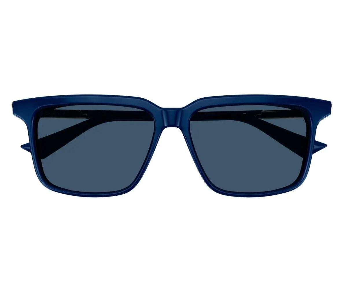 Blue sunglasses with dark lenses on a white background