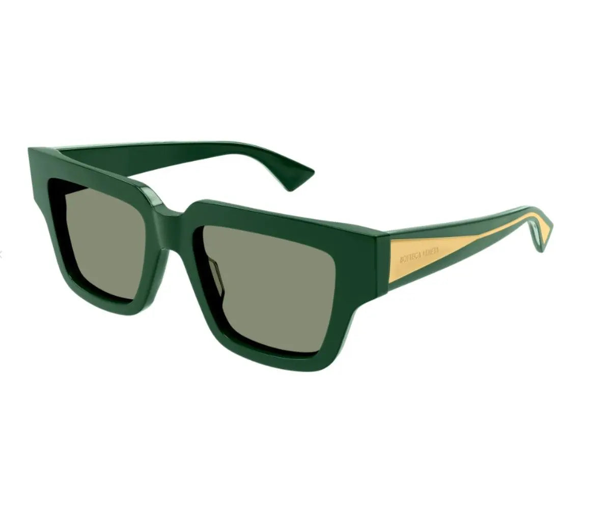 Green sunglasses with a gold accent on a white background