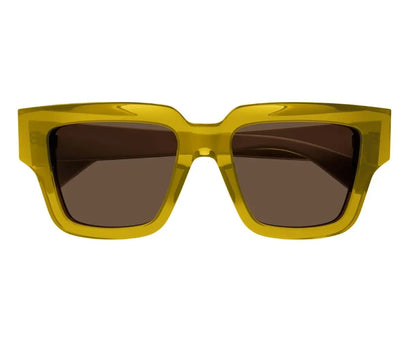 Yellow sunglasses with dark lenses on a white background