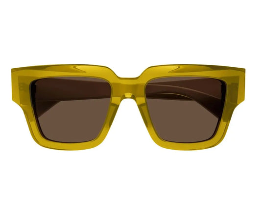 Yellow sunglasses with dark lenses on a white background