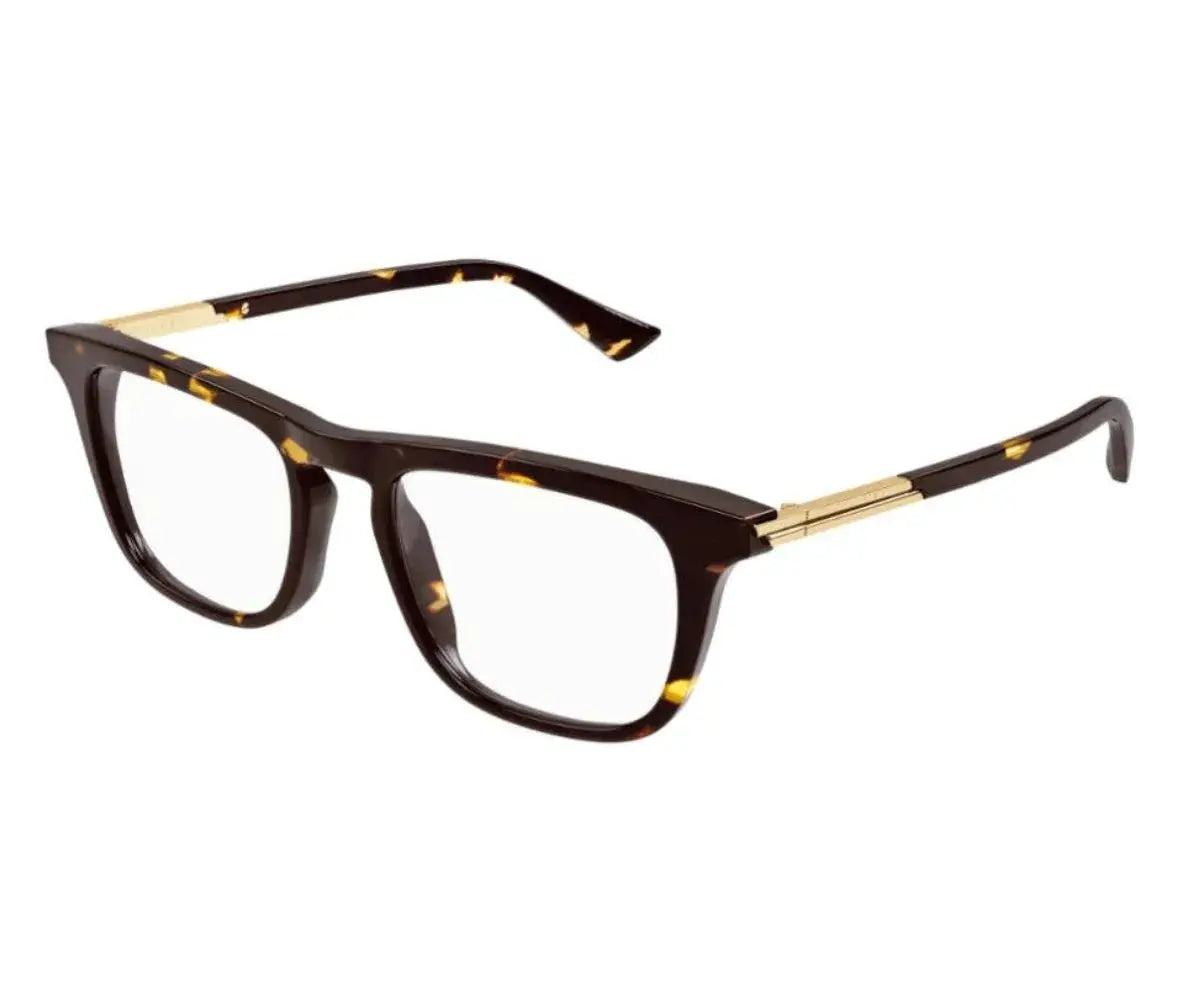 Brown and gold eyeglasses on a white background