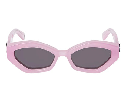 Pink sunglasses with dark lenses on a white background