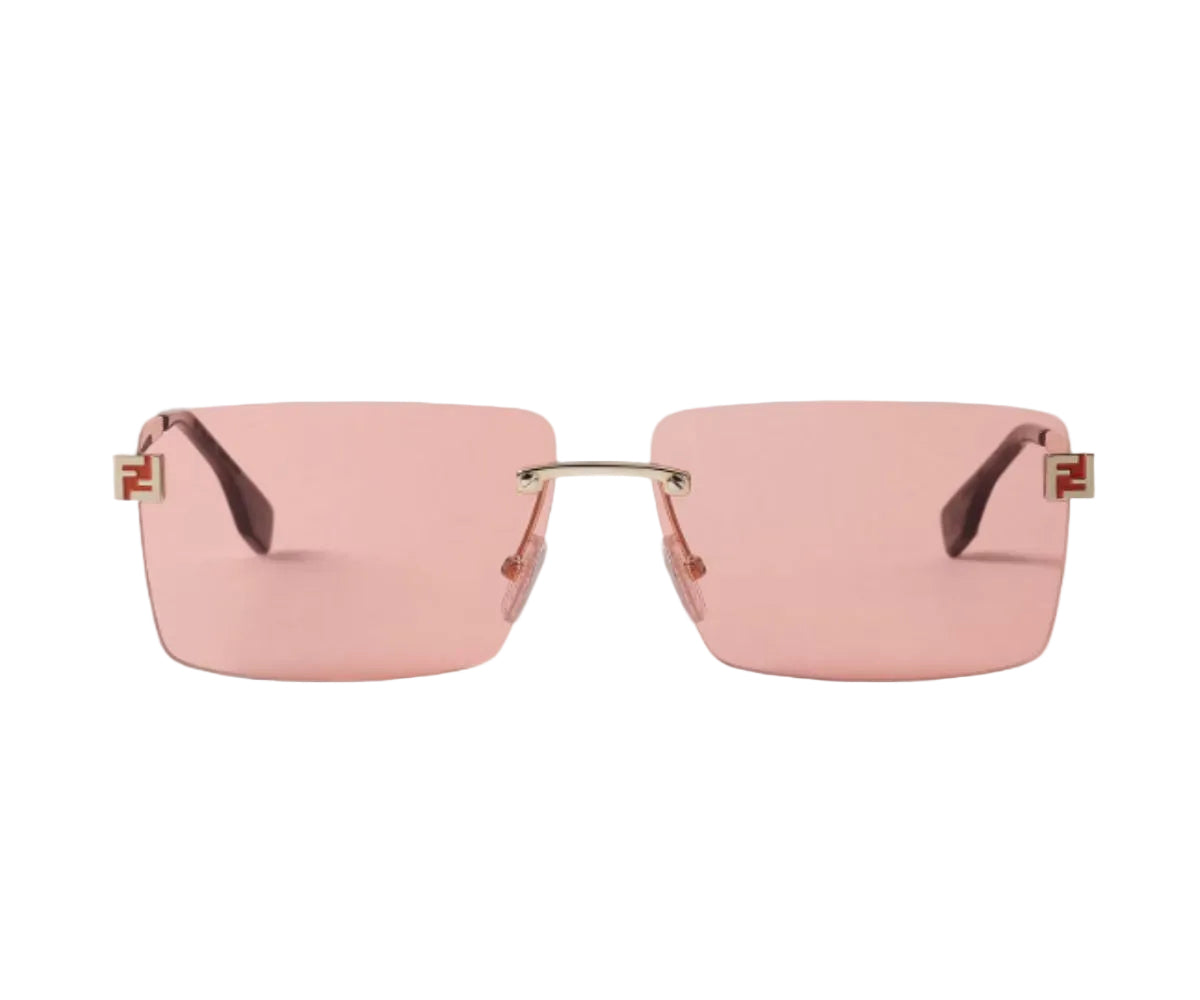 Pink sunglasses with gold accents on a white background