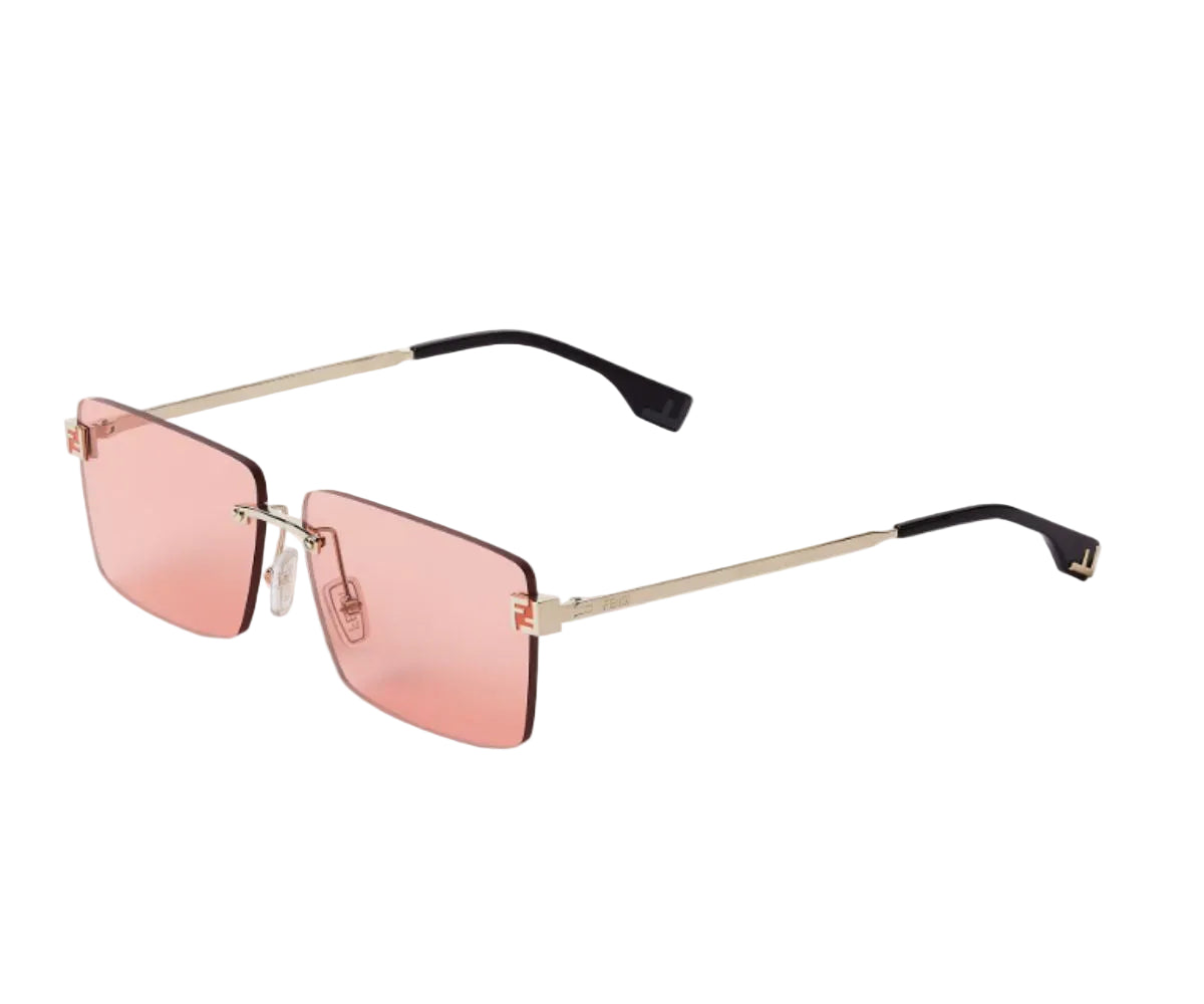 Sunglasses with pink lenses and gold frames on a white background