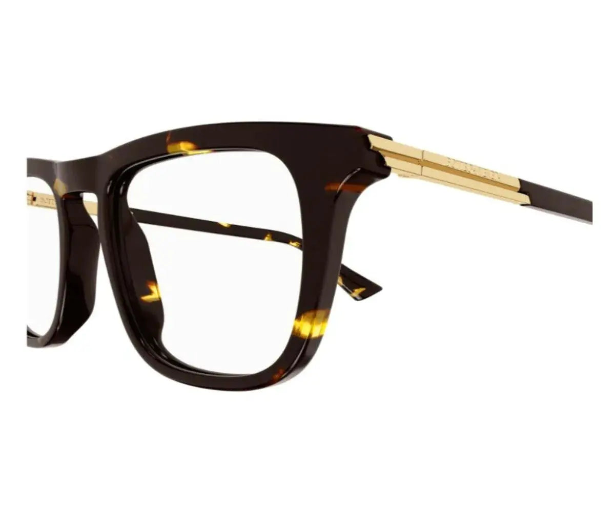 Eyeglasses with tortoiseshell frame and gold accents on a white background