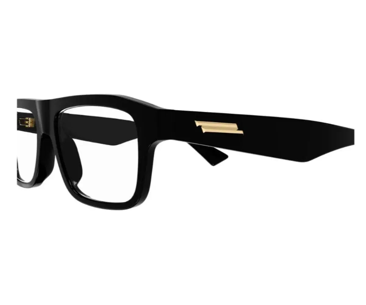 Black eyeglasses with gold accents on a white background
