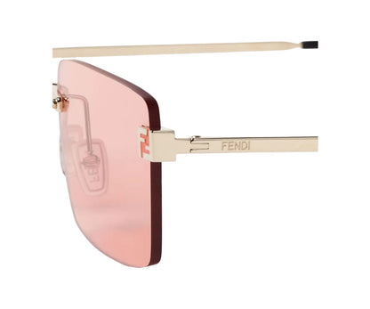 Sunglasses with pink lenses and gold frame on a white background