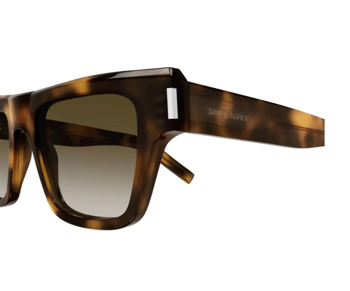 Sunglasses with tortoiseshell frame and gradient lens on a white background