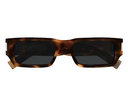 Sunglasses with tortoiseshell frame and dark lenses on a white background