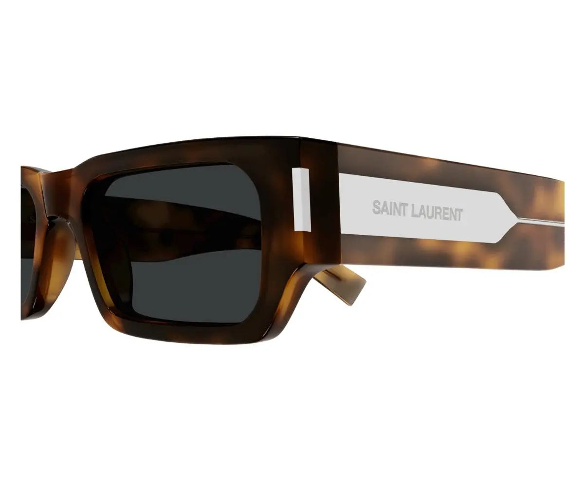 Sunglasses with tortoiseshell frame and dark lenses on a white background