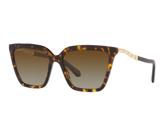 Sunglasses with tortoiseshell frame and brown gradient lenses on a white background
