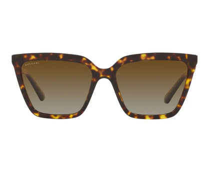 Tortoiseshell sunglasses with brown gradient lenses on a white background