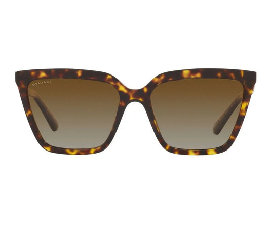 Tortoiseshell sunglasses with brown gradient lenses on a white background