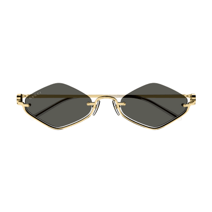 Gold-framed sunglasses with black lenses on a transparent background