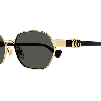 Sunglasses with gold frame and black lenses on a transparent background