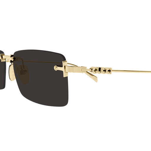 Gold-framed sunglasses with black lenses on a white background