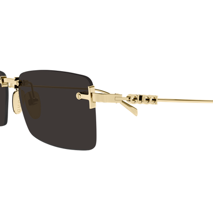 Gold-framed sunglasses with black lenses on a white background
