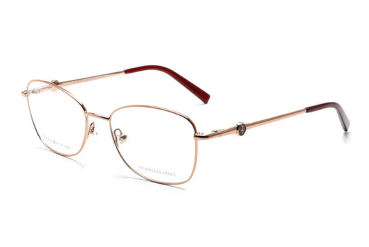 Gold-framed eyeglasses with red accents on a white background