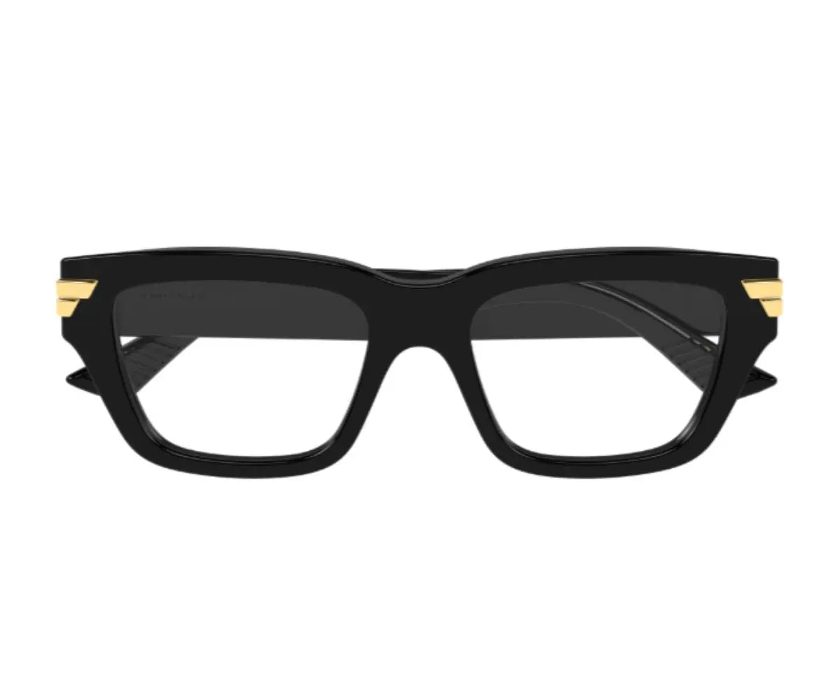 Black cat-eye glasses with gold accents on a white background