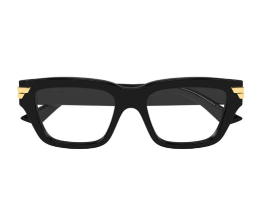 Black cat-eye glasses with gold accents on a white background