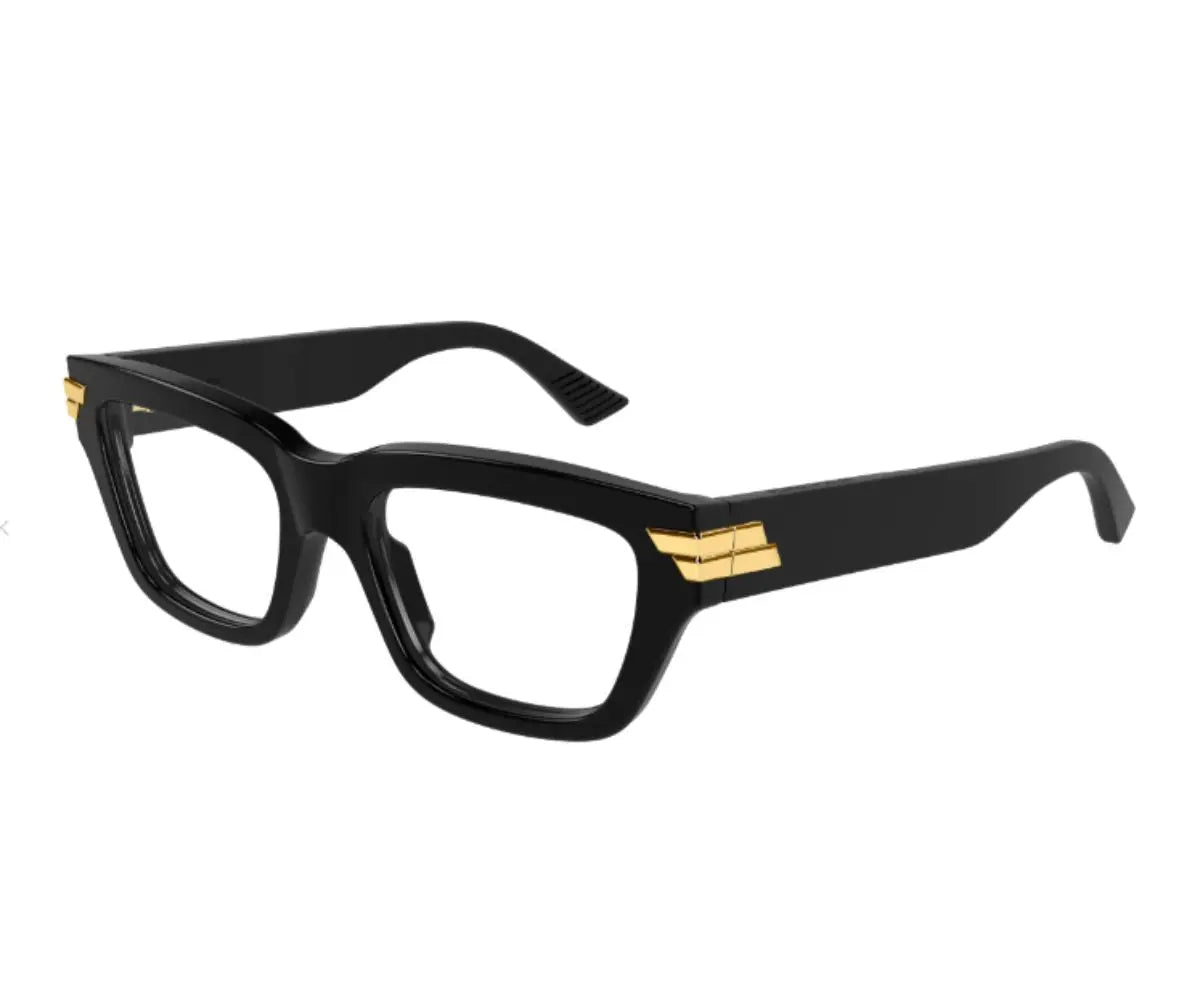 Black eyeglasses with gold accents on a white background