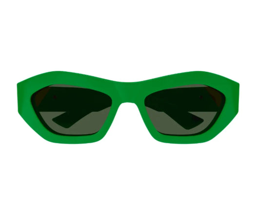 Green sunglasses with dark lenses on a white background