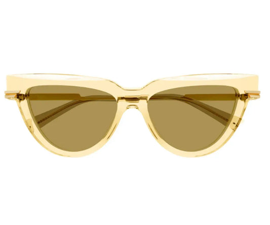 Gold cat-eye sunglasses with brown lenses on a white background