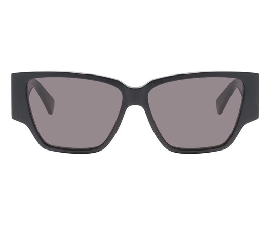 Black sunglasses with dark lenses on a white background