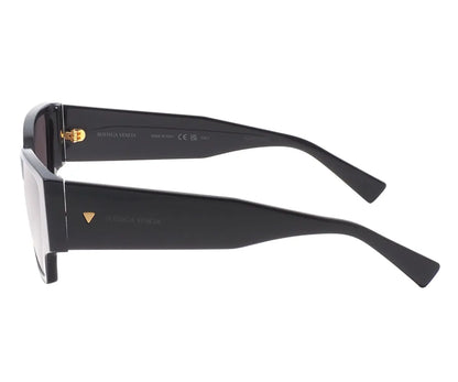 Black sunglasses with gold accents on a white background