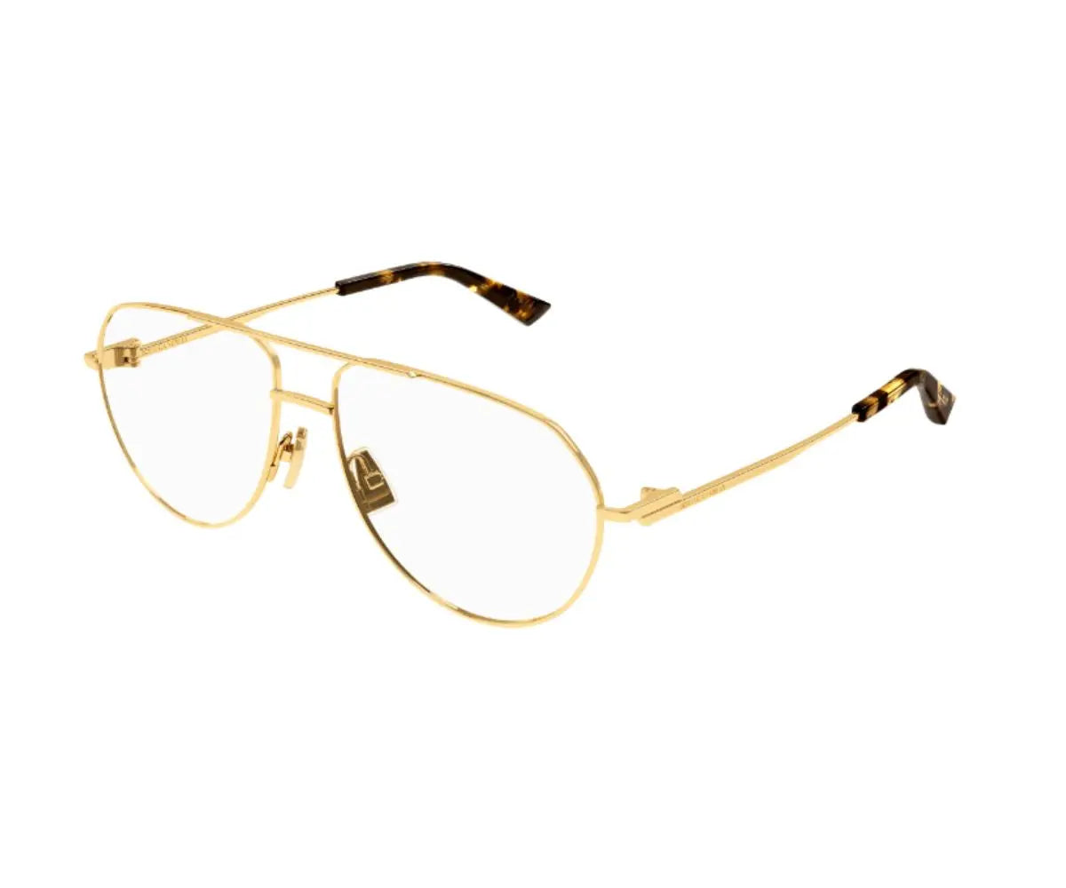 Gold eyeglasses with tortoiseshell accents on a white background