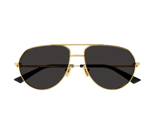 Gold-framed sunglasses with black lenses on a white background