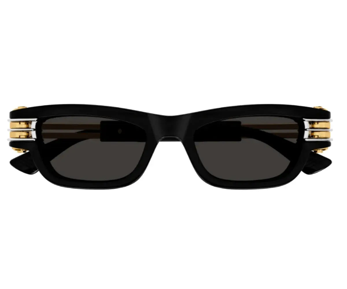 Black sunglasses with gold accents on a white background