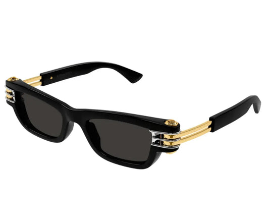 Black sunglasses with gold accents on a white background