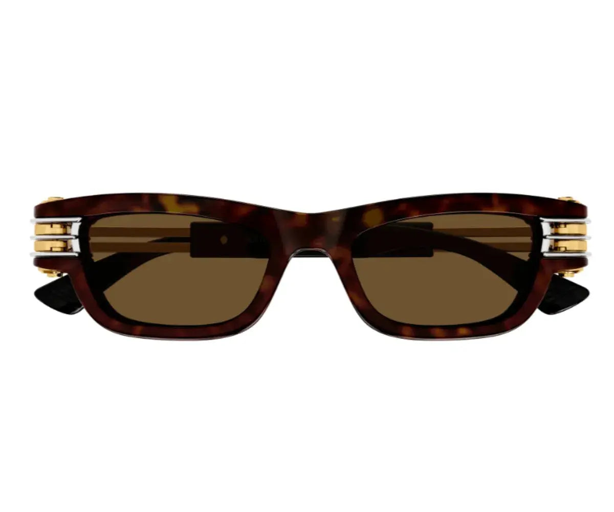 Sunglasses with tortoiseshell frame and gold accents on a white background
