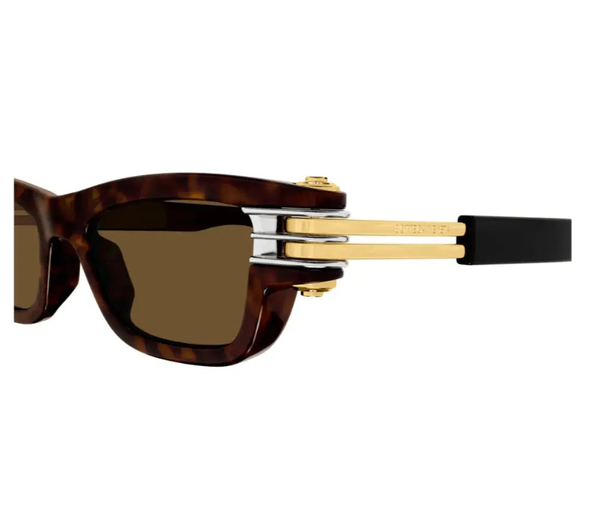 Sunglasses with tortoiseshell frame, gold accents, and brown lenses on a white background