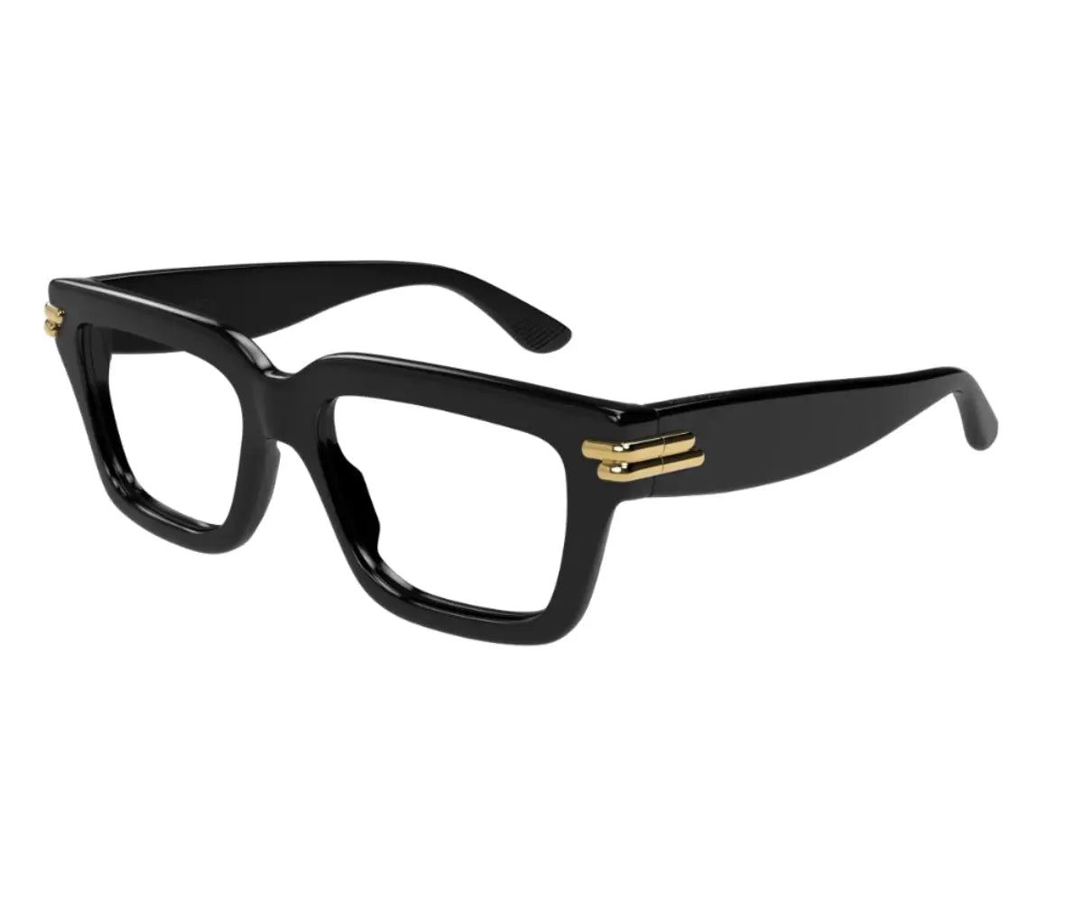 Black eyeglasses with gold accents on a white background