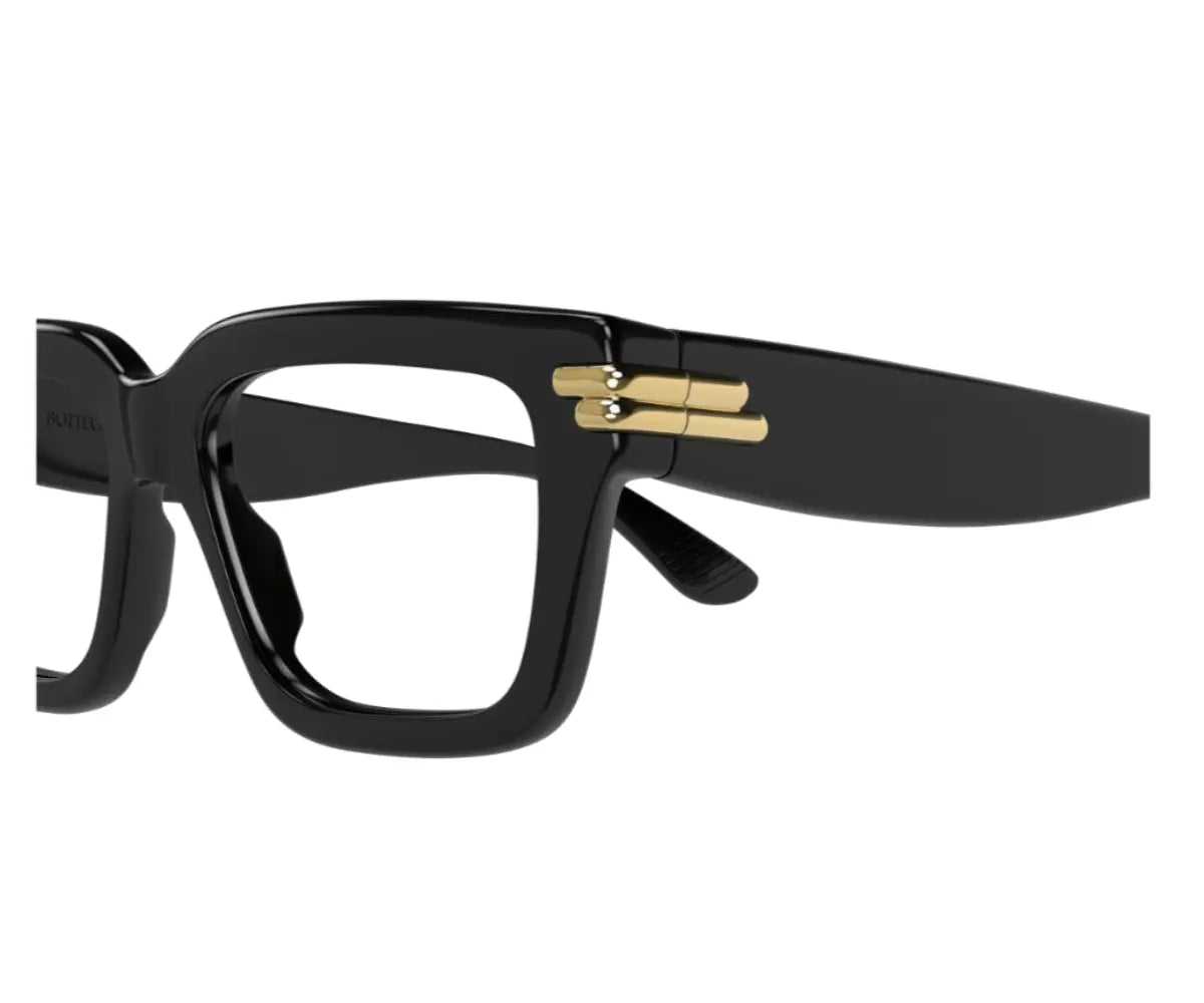 Black glasses with gold accents on a white background