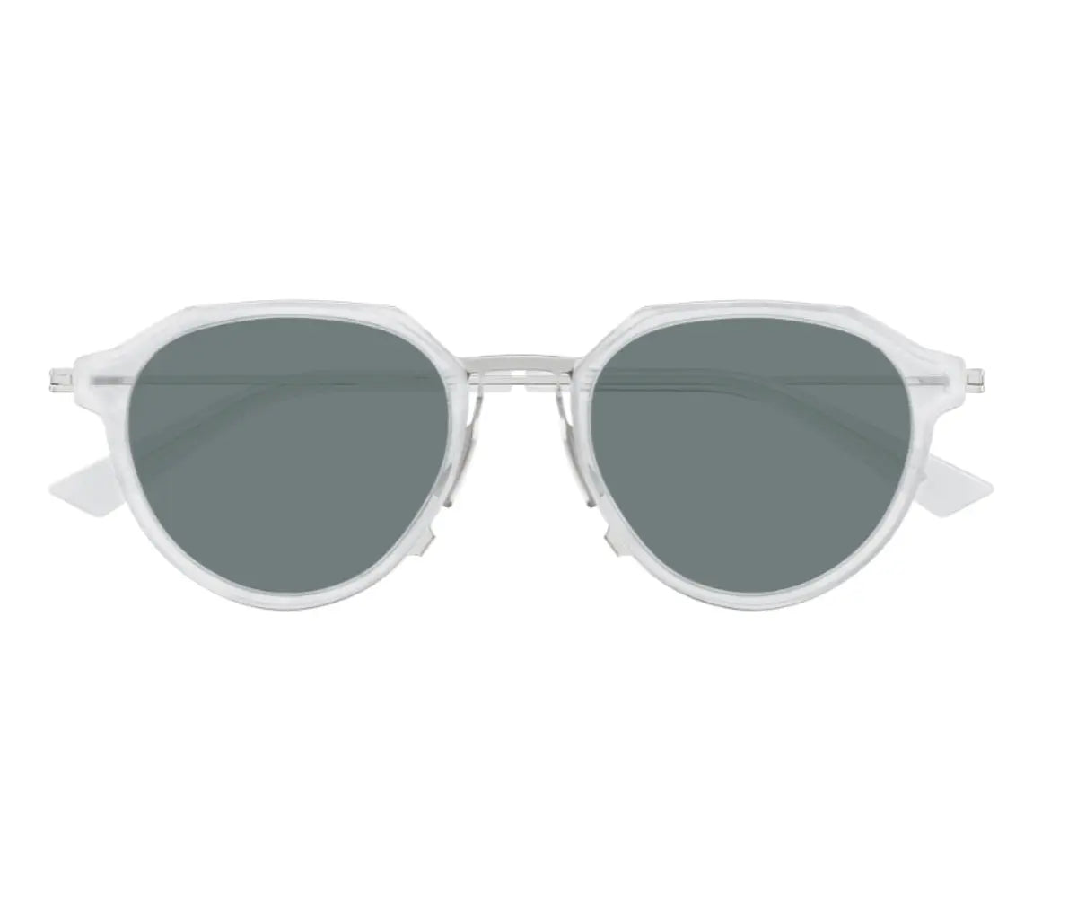 Sunglasses with a silver frame and dark lenses on a white background