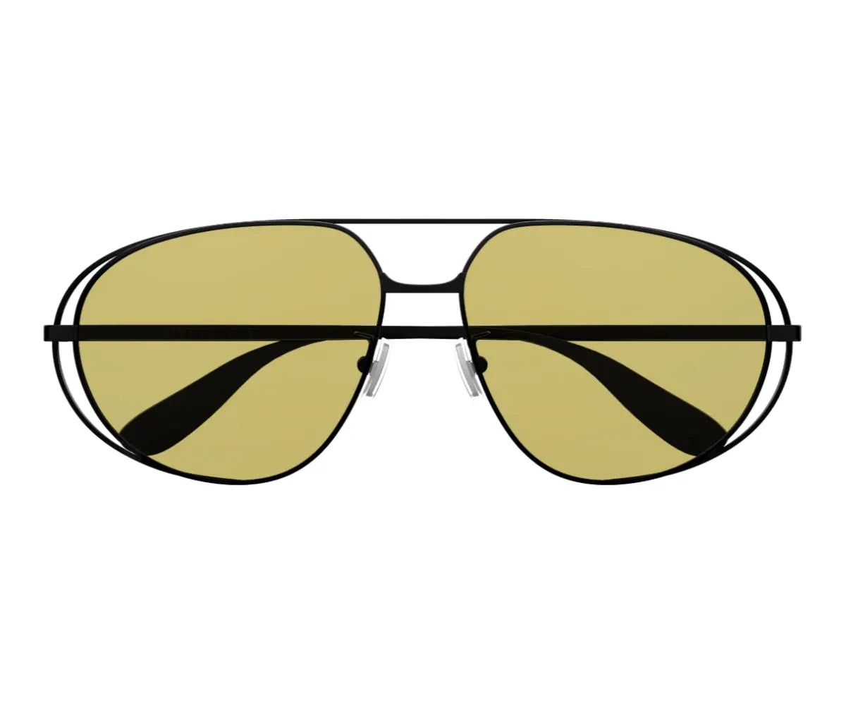 Aviator sunglasses with gold lenses and black frames on a white background