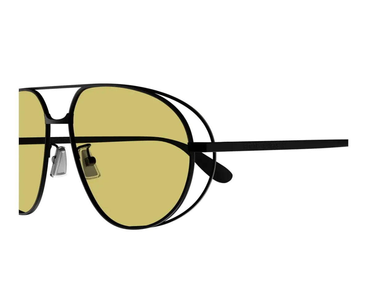 Sunglasses with gold lenses and black frame on a white background