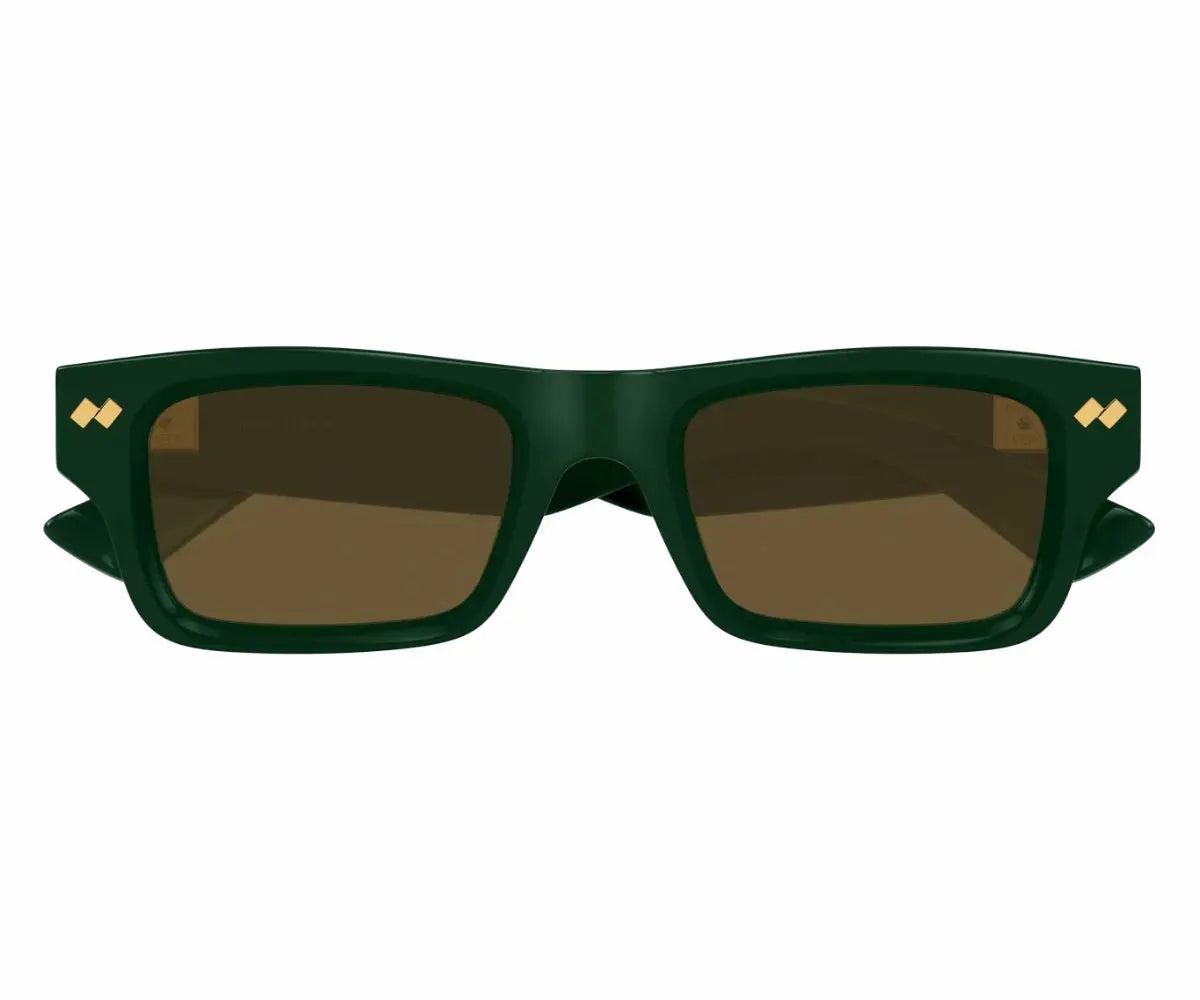 Green sunglasses with brown lenses on a white background