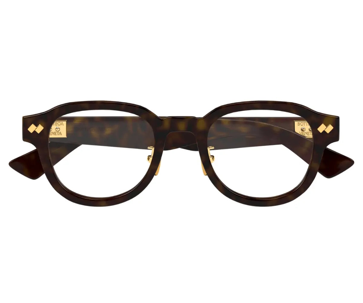 Brown tortoiseshell eyeglasses with gold accents on a white background