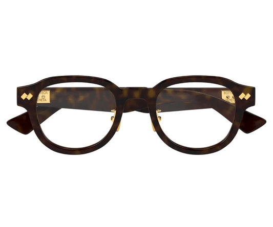 Brown tortoiseshell eyeglasses with gold accents on a white background