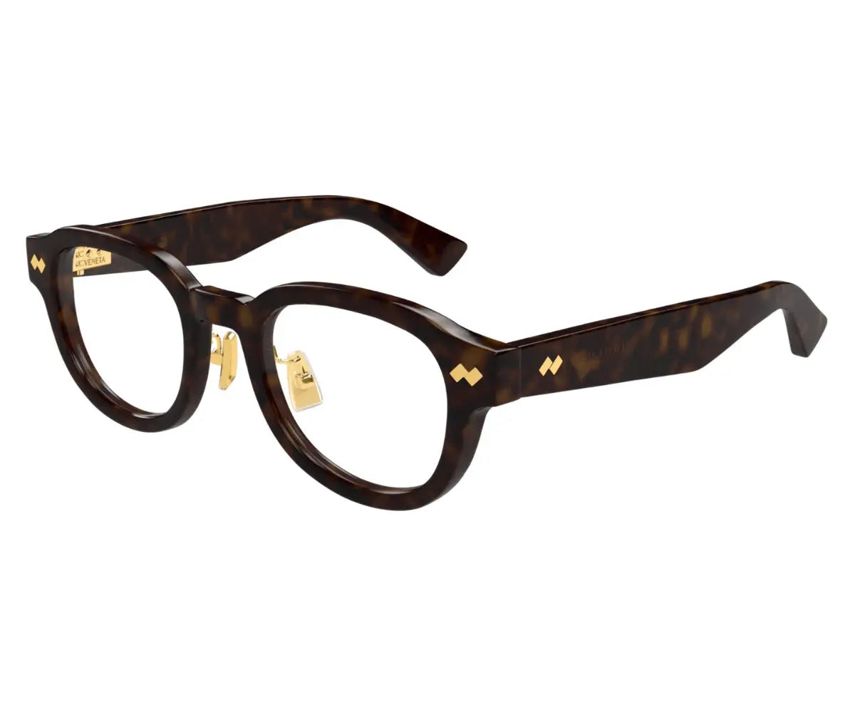 Brown eyeglasses with gold accents on a white background