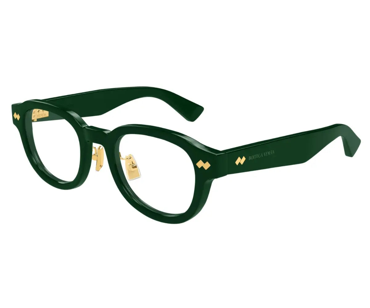 Black eyeglasses with gold accents on a white background