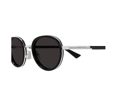 Round sunglasses with black lenses and silver frame on a white background