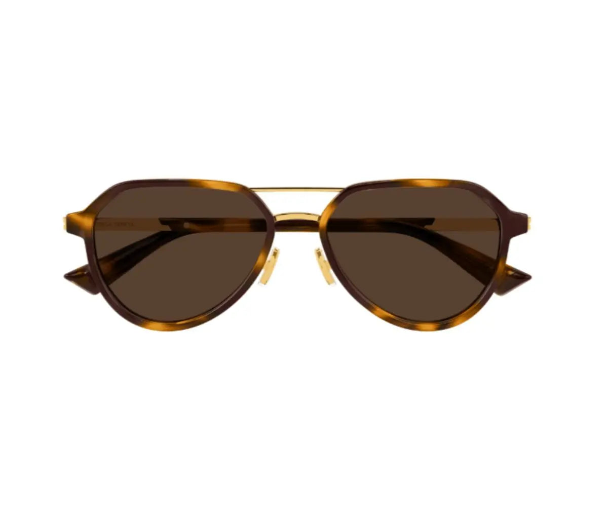 Sunglasses with brown lenses and gold frame on a white background