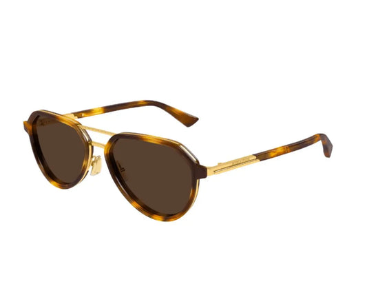 Sunglasses with tortoiseshell frame and brown lenses on a white background