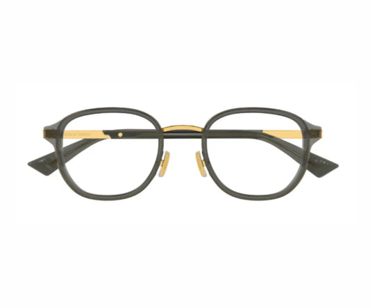 Round eyeglasses with black and gold frame on a white background
