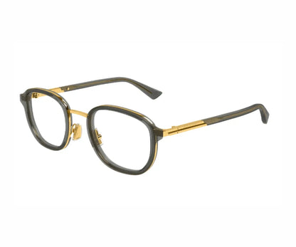 Eyeglasses with gold and black frame on a white background